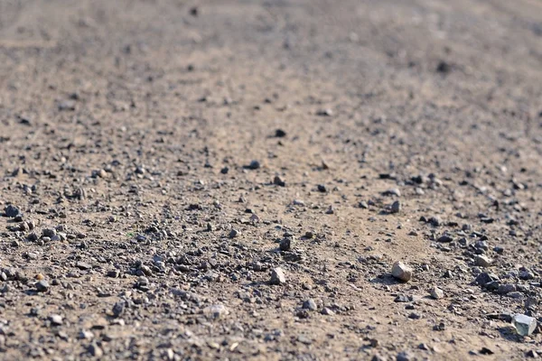 Terrain road with small rocks on the ground