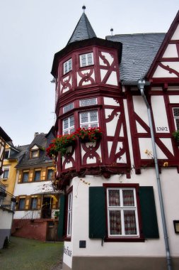 Tower on the side of Altes Haus, Old House, an historic half-timbered building in Bacharach, Germany.
