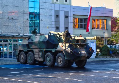 Polish soldiers climbing on military vehicle at an event in Boleslawiec, Poland.