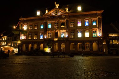 Gengenbach, Germany - December 13, 2020: Every year during Advent, the town hall in Gengenbach is turned into an Advent Calencar. Each night at 6pm a shade is pulled up on one window showing the artwork.