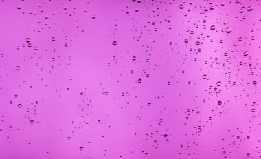 (Cam pencere üzerinde yağmur damlaları)