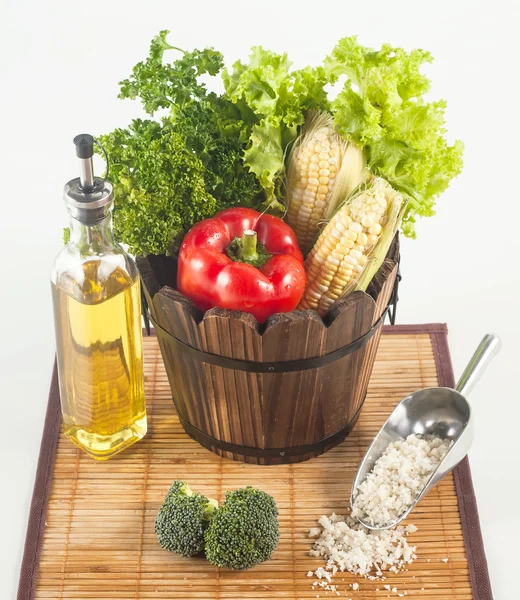 Fresh vegetables and other raw material set on a bamboo mat — Stock Photo, Image