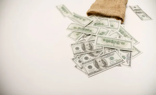 Money in the bag on a white background — Stock Photo, Image