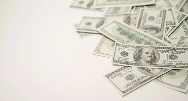 Dollars op een witte achtergrond. — Stockfoto