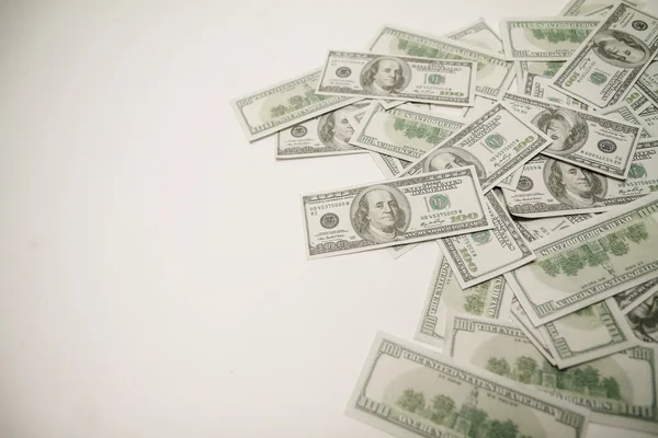 Dollars op een witte achtergrond. — Stockfoto