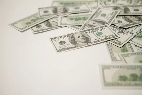 Dollars op een witte achtergrond. — Stockfoto
