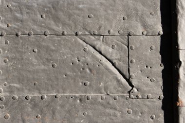 Old steel plate with rivets for background