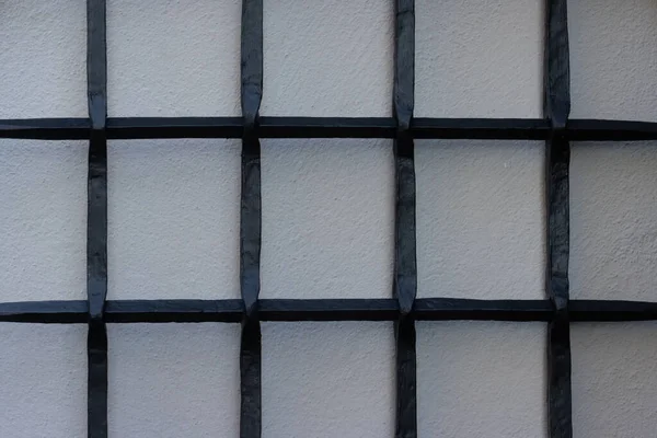 Close Black Cast Iron Grid Front White Wall — Stok fotoğraf
