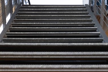 Looking up a metal staircase with focus on foreground