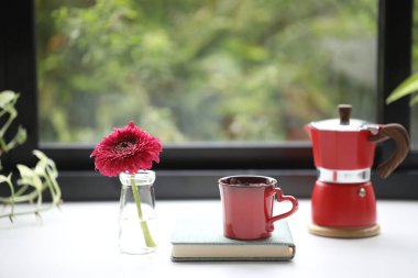 Red coffee cup and red moka pot with gerbera flower clipart