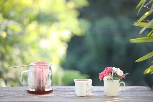 Rose tea and tea strainer filter pot and flowers