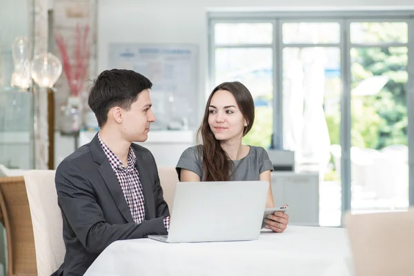 Businesspeople  talk to each other.