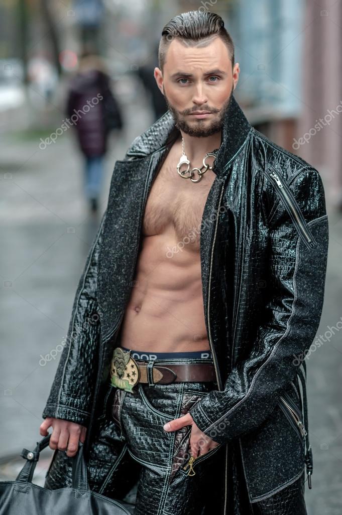 Stylish man with bag in a leather coat. Stock Photo by ©maxiporik 47628651 Stylish man with bag in a leather coat. Stock Photo by ©maxiporik 47628651