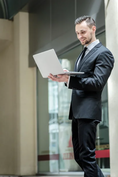 Businessman  holding a laptop