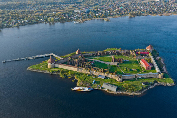 Aerial photography of the Oreshek Fortress in Shlisselburg in summer in Lake Ladoga. Top view of Walnut Island with a fortress. Russia, Shlisselburg, 08.21.2021
