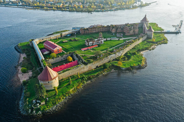 Aerial photography of the Oreshek Fortress in Shlisselburg in summer in Lake Ladoga. Top view of Walnut Island with a fortress. Russia, Shlisselburg, 08.21.2021