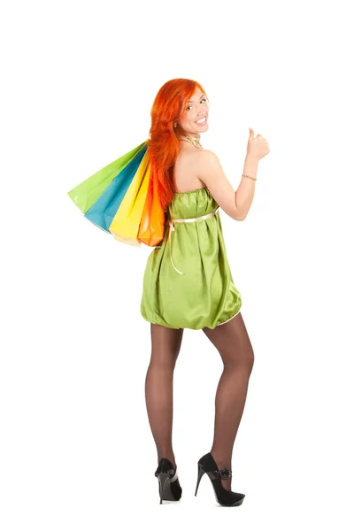 Alışveriş torbaları ile Kızıl saçlı kadın — Stok fotoğraf