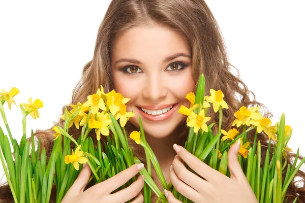 Meisje en narcissen — Stockfoto