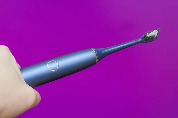 Blue Electric Toothbrush Hand Purple Background — Stock Photo, Image