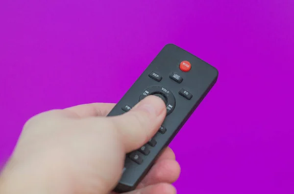 Box Remote Control Hand Purple Background — Stock Photo, Image