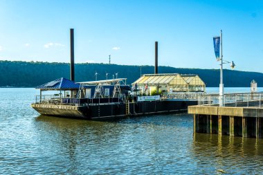 Yonkers, NY - Aug 13, 2022 Landscape view of the Science Barge, a self sustaining floating hydroponics farm and education center located in downtown Yonkers.