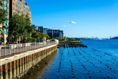 Yonkers, NY - Aug 13, 2022 Landscape view of redeveloped Yonkers waterfront. Lined with restaurants, luxury apartments and public spaces.
