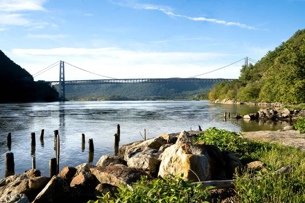 Fort Montgomery, NY - USA - Aug 14, 2022 Landscape view of the iconic Bear Mountain Bridge, a toll suspension bridge in New York. Spanning the Hudson River between Orange County and Westchester county