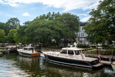 Kingston, NY - USA - Aug 2, 2022 Horizontal view of boats tied up on the Roundout Creek in the RondoutWest Strand Historic Districts Waterfront.