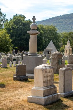 West Point, NY - USA - Aug 26, 2022 Vertical view of the West Point Cemetery, a historic cemetery on the grounds of the U.S. Military Academy in West Point, New York. It overlooks the Hudson River.