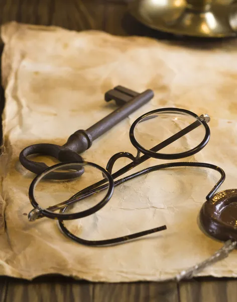 Old glasses on the vintage document — Stock Photo, Image