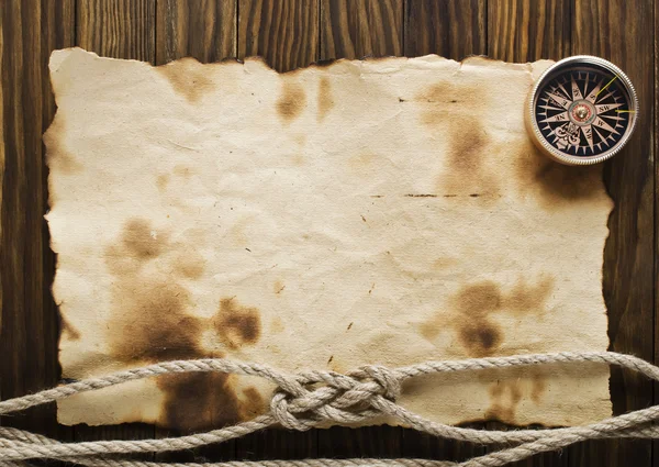 Rope and compass on the old paper background — Stock Photo, Image