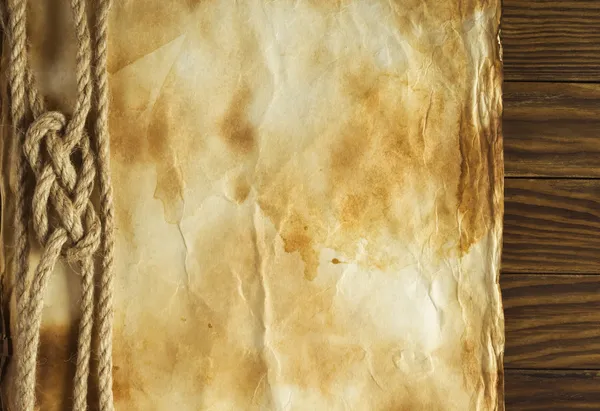 Eski kağıt arka planda eski bir ip — Stok fotoğraf