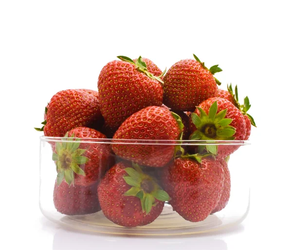 A heap of fresh strawberries in glass bowl. Isolated — Stock Photo, Image