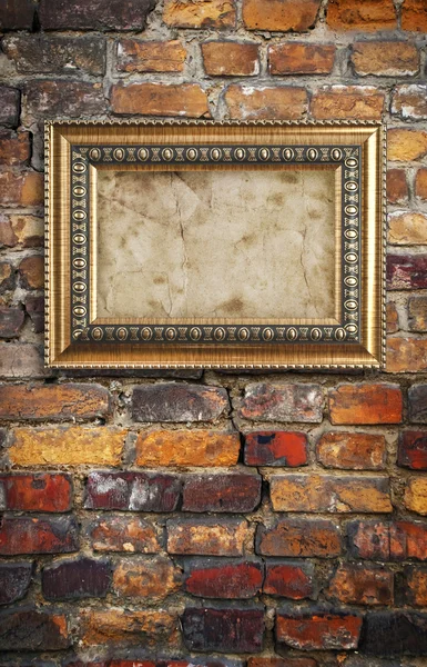 Wooden frame on brick wall — Stock Photo, Image