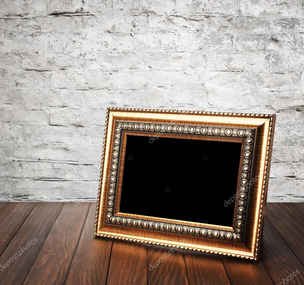 Old photo frame on the wooden table — Stock Photo © ulkan 34866395