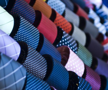Colorful italian ties in soft focus clipart