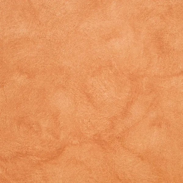 Orange colored plastered wall Stock Picture