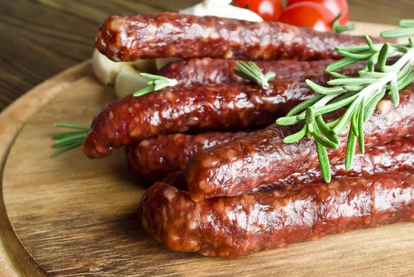 Smoked sausage with rosemary — Stock Photo, Image