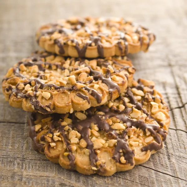 Chocolate chip cookies on wooden table (selective focus) — Stock Photo, Image