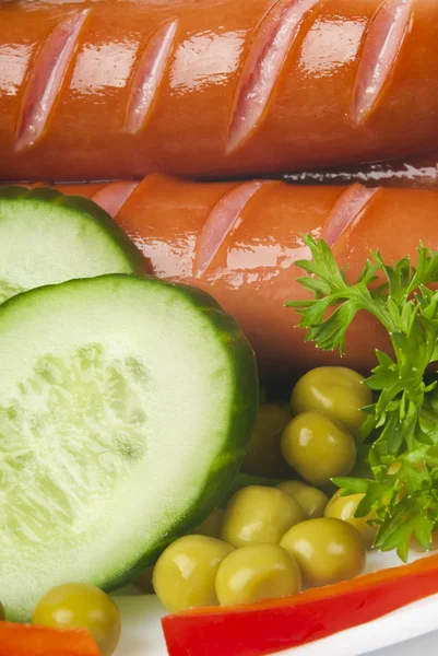 Close up of sausage and fresh vegetables — Stock Photo, Image