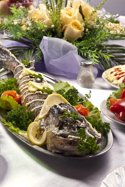 Pike prepared fish and some salads behaind — Stock Image Pike prepared fish and some salads behaind Stock Picture