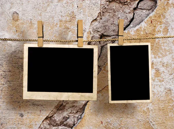 Film Blanks Hanging on a Rope Held By Clothespins on a Grunge Background — Stock Photo, Image