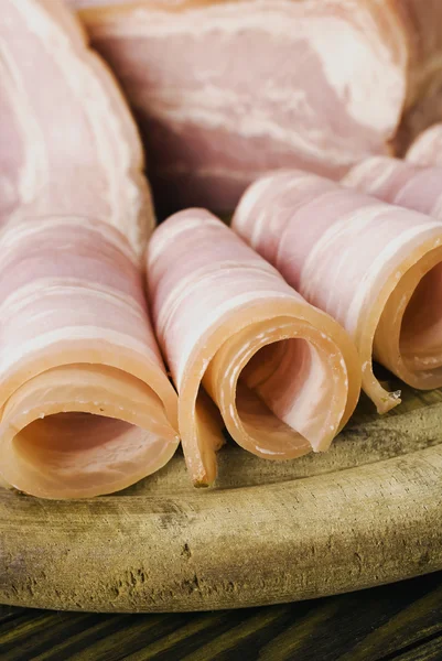 Fresh ham slices on the wooden board — Stock Photo, Image
