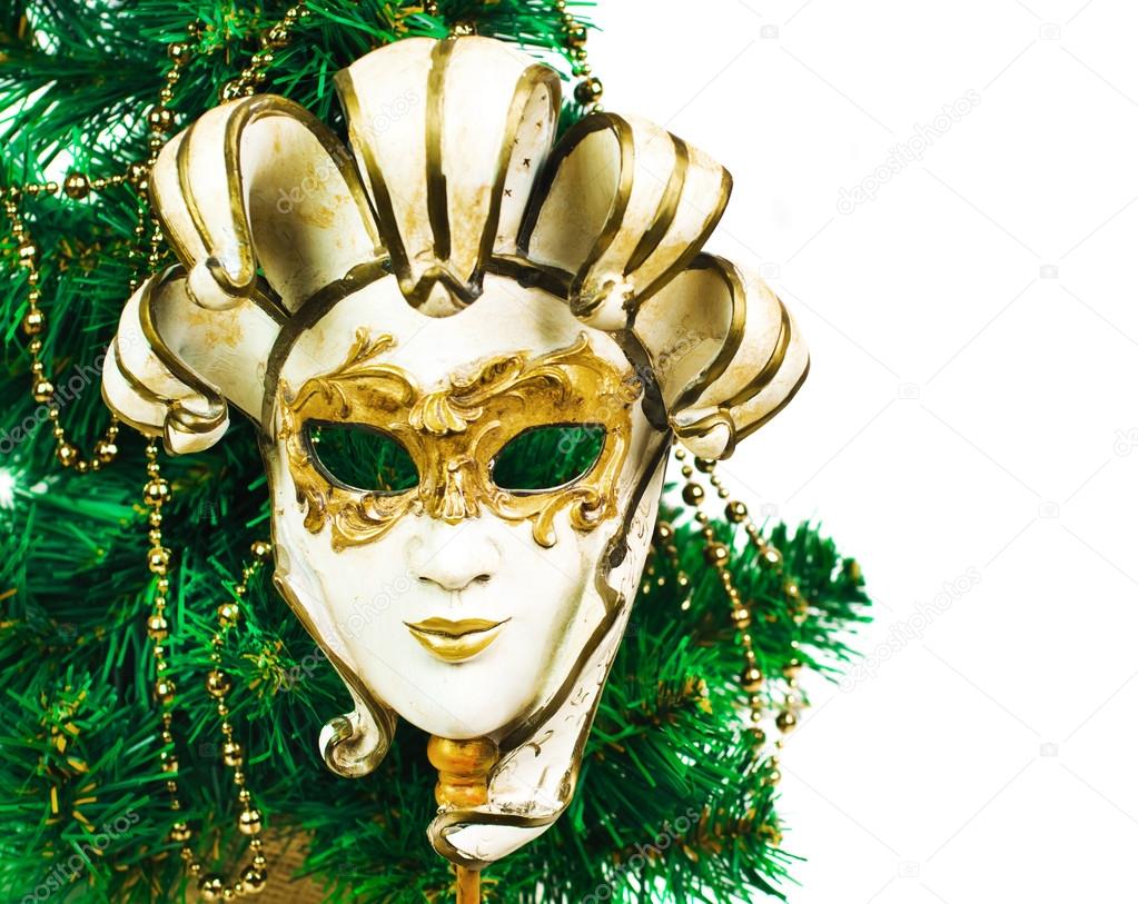 Christmas decoration with tree and carnival mask on a white background