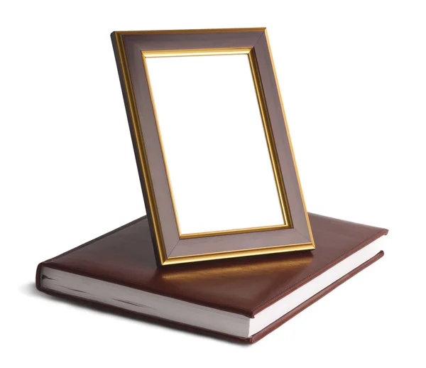 Wooden frame on book — Stock Photo, Image