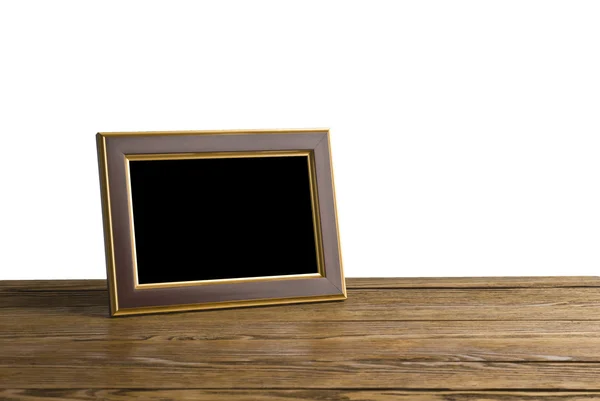 Old photo frame on the wooden table — Stock Photo, Image