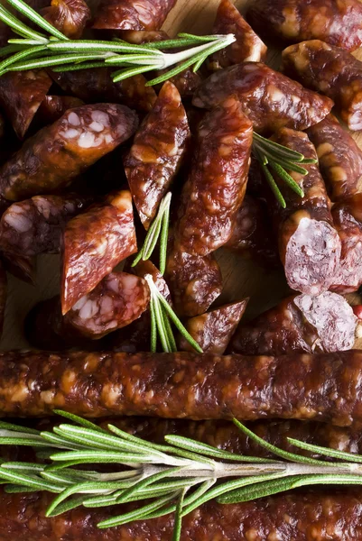 Smoked sausage with rosemary and peppercorns — Stock Photo, Image
