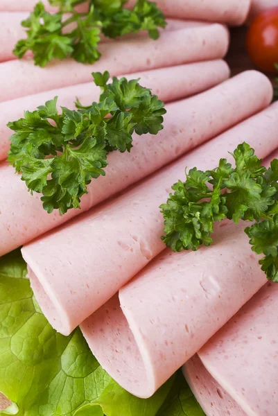 Fresh ham slices with lattuce and cherry tomato on the wooden board Stock Photo