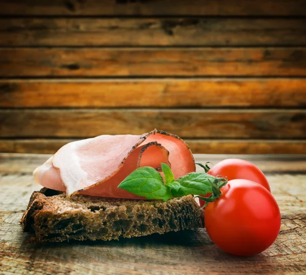 Bread with sliced pork ham — Stock Photo, Image