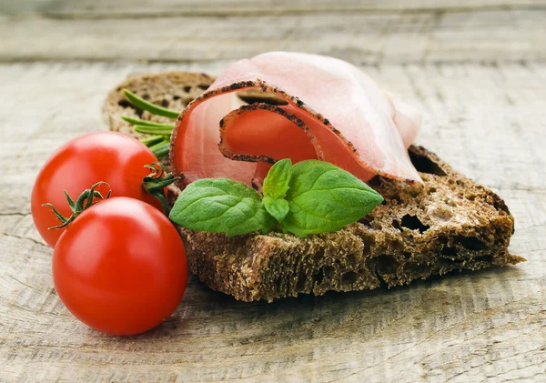 Bread with sliced pork ham — Stock Photo, Image
